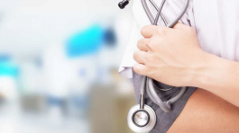 Healthcare professional holding a stethoscope, representing the healthcare vertical supported by Prospecta.